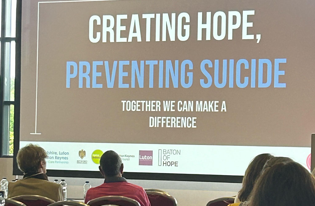 A group of people taking part in a suicide prevention talk.