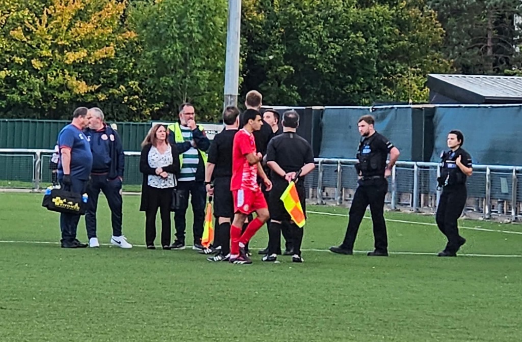 Police attend the abandoned football match between Harlow Town and Kempston Rovers after an allegation of racist abuse in September 2025