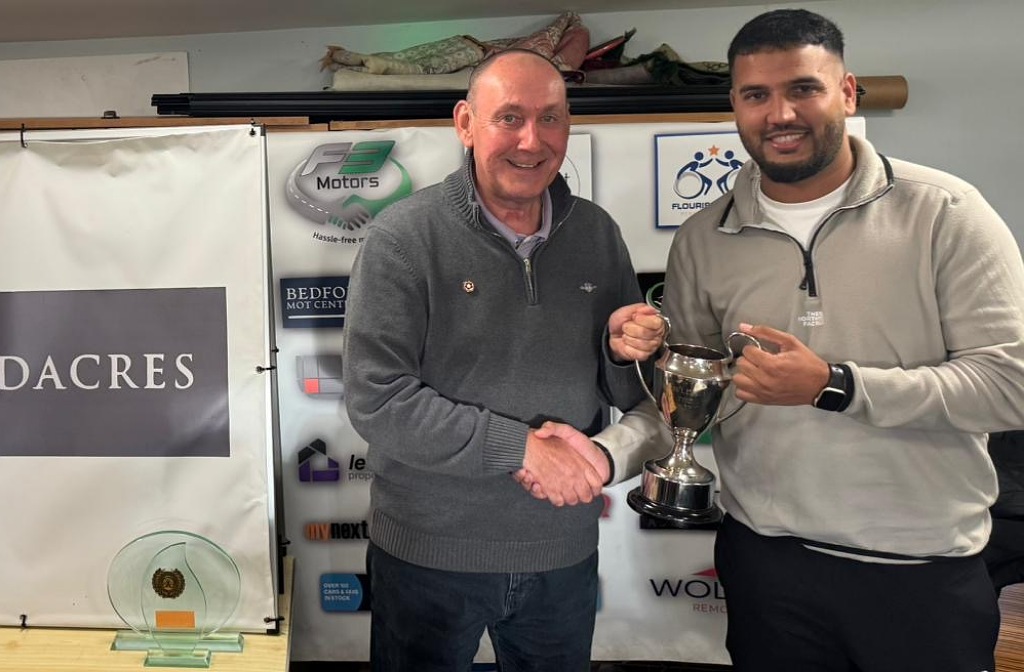 Queen's Park Westfield Cricket Club's Aqib Iqbal collecting his award from Martin Darlow
