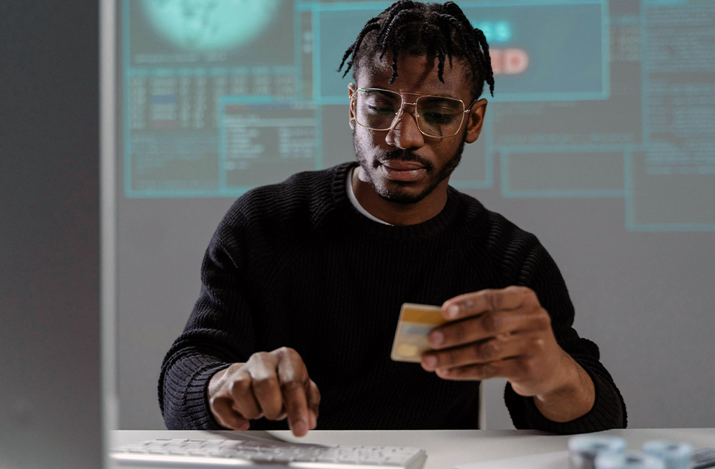 Man making a payment online with a credit card Image Tima Miroshnichenko Unsplash