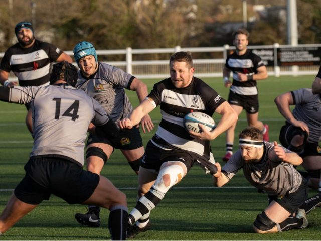 Bedford Athletic rugby player heads into a tackle against Market Harborough