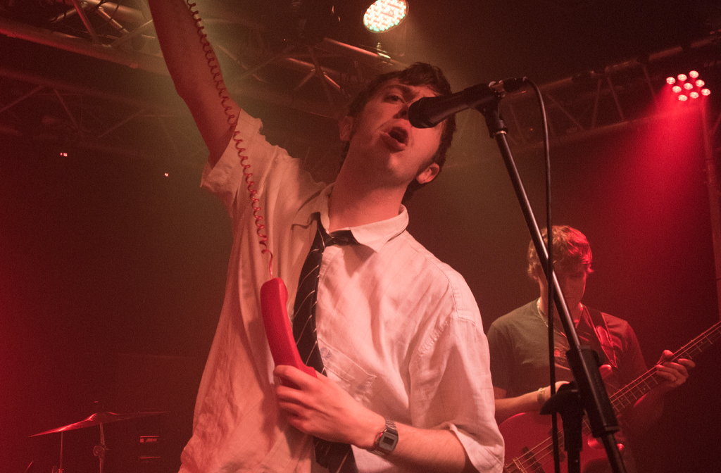 2008 calling Vincent's Last Summer at Ceremony 5.5 at Esquires. The lead singer is holding up a landline phone to the audience. Image: Kane Howie
